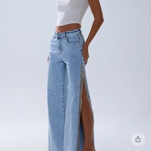 Beautiful embellished  wide leg Jeans with thigh high slit rhinestone detail.